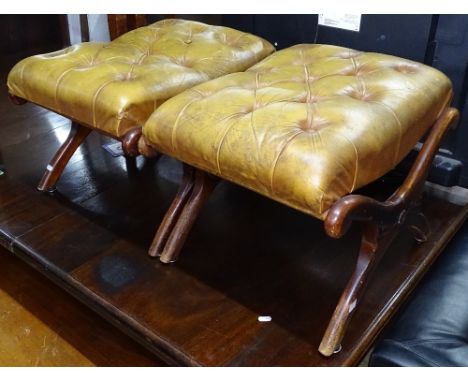 A pair of button-back leather upholstered mahogany X-framed footstools, W57cm 