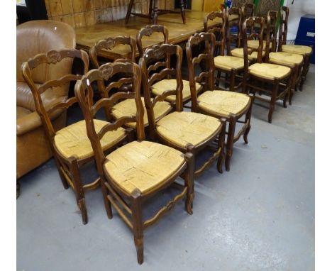 A set of 12 French oak ladder-back and rush-seated dining chairs 