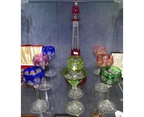 A set of 6 harlequin cut-crystal hock glasses, and 2 others, and a ruby overlay cut-crystal decanter and stopper 
