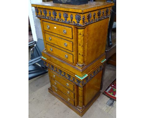 A pair of reproduction walnut 3-drawer bedside chests, in architectural style, with applied decoration and turned columns, on