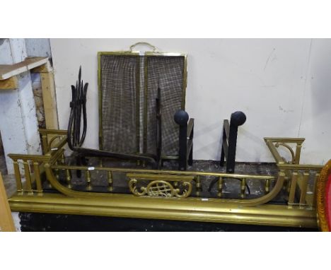 A Victorian brass and iron fender, an Art Nouveau brass fender, 2 pairs of steel firedogs, and a brass-framed 3-fold mesh fir