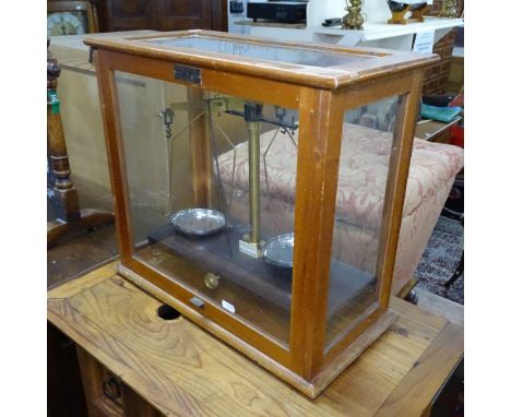 A Vintage teak-cased balance beam scales, label for Griffin &amp; Tatlock Ltd 
