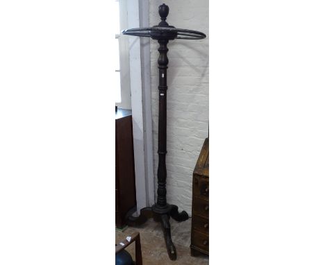 A stained beech and metal hat and coat stand 