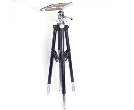 An adjustable chrome-mounted steel tripod 