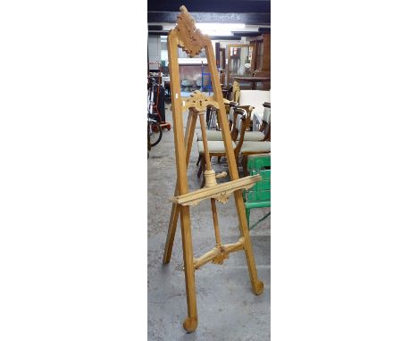 A hardwood floor standing artist's easel 