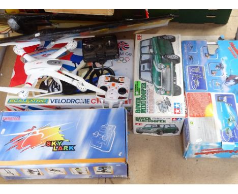 A Scalextric velodrome, a boxed Mini Cooper, Smartech Skylark, and a Humblebee helicopter, and a MJX R/C drone etc 
