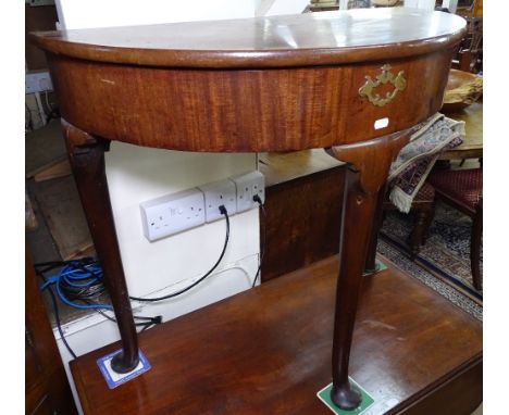 A Georgian mahogany demilune console table, with rising lid, raised on cabriole legs with pad feet, W76cm, H70cm 