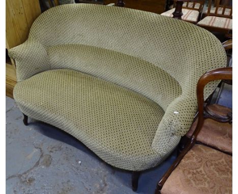 An upholstered bow-back French sofa 