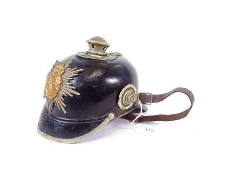 A German First War Period leather Pickelhaube Saxony helmet, original strap and lining and badge, size 57 