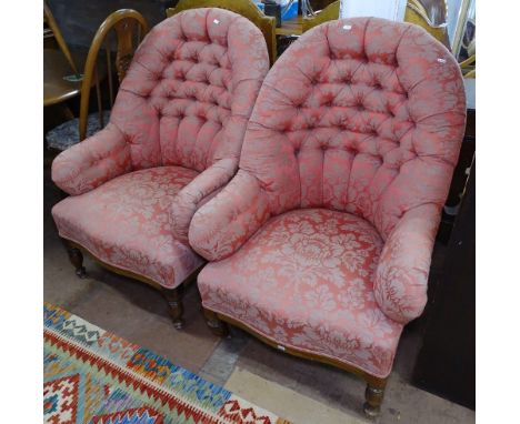 A pair of button-back upholstered armchairs, with turned mahogany legs 