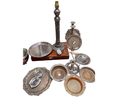 A collection of silver plate to include a column lamp, go to bed , wine coasters etc. 