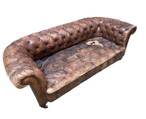 For restoration: a good brown leather Chesterfield sofa, button backed and brass studded on castors, 180cm Long x 84cm Deep x