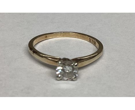 An 18ct gold single stone diamond ring. Brilliant cut diamond in a four claw setting. Diamond approx 4mm. Size M. 2.08g. 