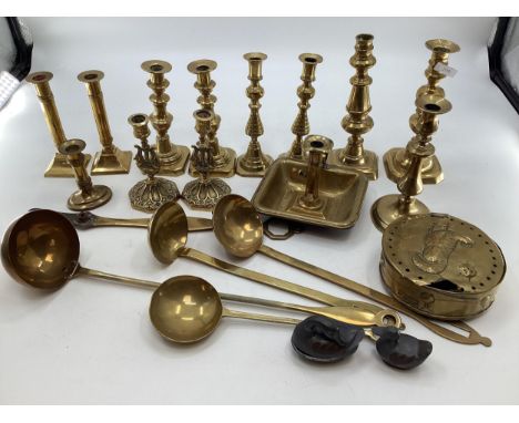 A collection of brass items to include 5 pairs of candlesticks, a 19th century go to bed, large ladle and other items; AND  t