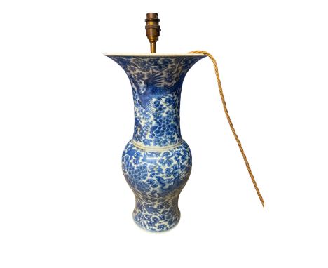 A blue and white Chinese style ceramic lamp, with brass light fitting, not drilled to base, some chips and restoration 