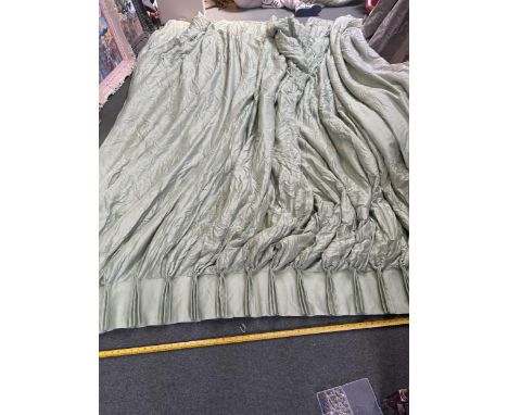 A pair of ex De Gournay display curtains, in a light green fabric "Silk Duchess Satin with braid"&nbsp;225 cm&nbsp; wide at t