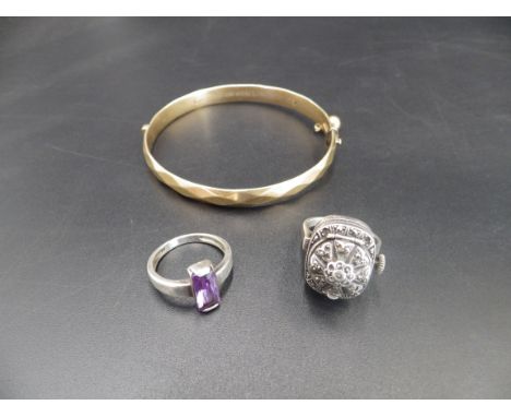A vintage 17 jewels, Marcasite and silver ring watch, a silver ring with a purple stone and a 9ct rolled gold bangle