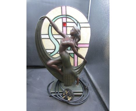 An art deco style lamp with bronzed figure of a lady with tiffany style shade 39cmH
