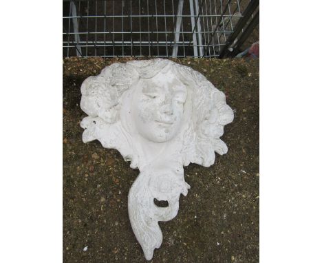 A garden wall planter in form of a maidens head