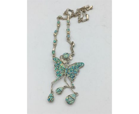 A substantial silver and opal butterfly necklace