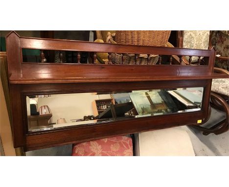 A Mahogany hall mirror with shelf