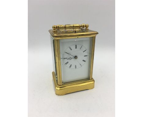 A Brass Carriage clock, repeat striking in a carry case