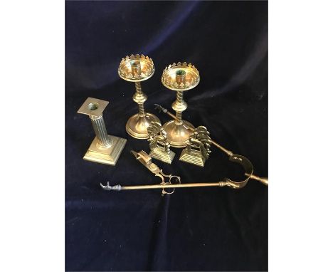 A box of sundry brass comprising a Pair of 8" candlestands; A pair of Peacock decorated bookends; another 6" candlestick; a p