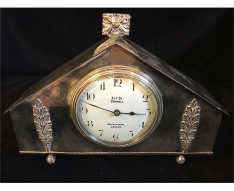 A white metal mantle clock by Connell of Cheapside London