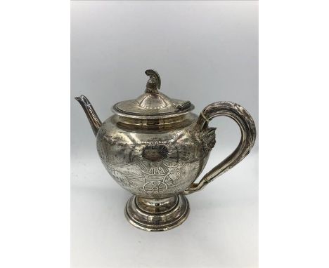 A silver teapot with helmet finial, hallmarked to base Edinburgh 1876, makers mark JA