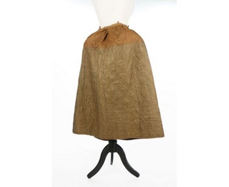 Two quilted silk petticoats, the first of olive green, c.1800, the hem quilted with scrolling floral motif; the other dark-br