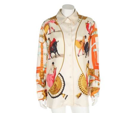 An Hermès 'Plaza de Toros' printed silk blouse, circa 1993, labelled size 44, design by  by Hubert de Watrigant, with matador