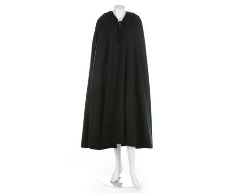 An Yves Saint Laurent dark green tweed burnouse style cape, circa 1976, labelled Rive Gauche, edged in black braid and trimme