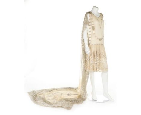 A beaded and embroidered couture ivory chiffon bridal or presentation tunic-dress, circa 1928, adorned with couched love knot