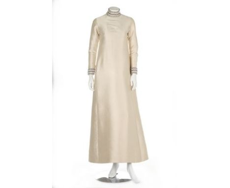 A Christian Dior London ivory gazar bridal gown, 1968, labelled and numbered 47011, with beaded collar and cuffs, the front p