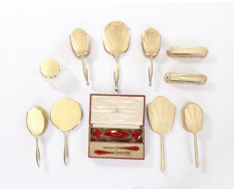 Assorted silver mounted and guilloché enamel vanity accessories, 1920s-30s, comprising; an Asprey manicure set, 1927; cut-gla