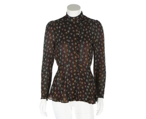 An Ossie Clark 'Moon and Stars' weave crepe blouse, early 1970s, with Russian-style high neck and side buttoning above peplum