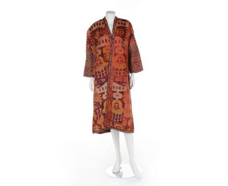 An ikat velvet chapan, Bokharan, circa 1900, with elaborately embroidered lower sleeves, lined in floral printed cotton, edge