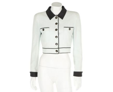 A Chanel pale ice-blue cotton cropped jacket, Spring-Summer 1995, with contrasting collar and cuffs, edged with black silk, a