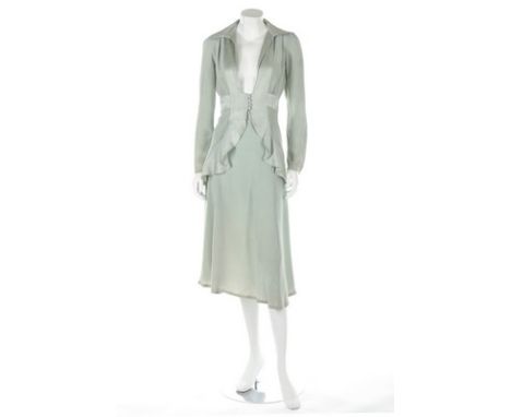 An Ossie Clark eau-de-nil satin and crepe evening ensemble, circa 1973, woven Quorum label and size 10, the jacket with plung