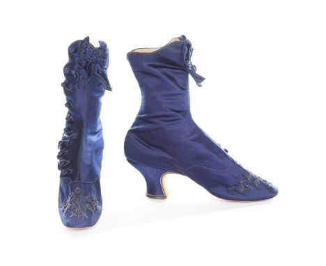 A pair of midnight-blue satin ladies' buttoned ankle boots, 1875-80, with beaded and embroidered rounded square toes and bow 