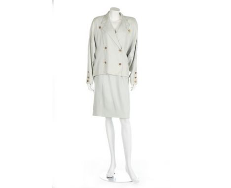 A Chanel couture dove-grey suit, circa 1984, labelled and numbered 64562, the double-breasted jacket with gilt coin-like butt