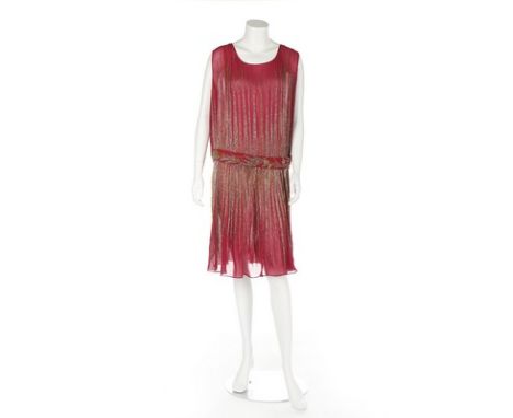 A dark-pink chiffon flapper dress, circa 1928, beaded overall with sun-ray points in shades of gold bugle beads, matching int