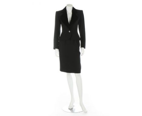 An Yves Saint Laurent 'Le Smoking' skirt suit, 1980s, Rive Gauche labelled and size 36, the wool jacket with curved velvet la