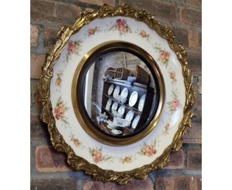 A. J. Wilkinson Ltd Staffordshire, a gilded framed convex type mirror with porcelain decoration of roses. (B.P. 21% + VAT)