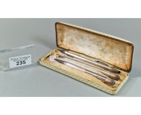 Two silver engine turned writing implements, together with another Cross 925 silver pen. (B.P. 21% + VAT)