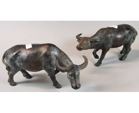 Pair of probably Chinese cast bronze Water Buffalo, 19cm from nose to tail approx. Unmarked. (2) (B.P. 21% + VAT)