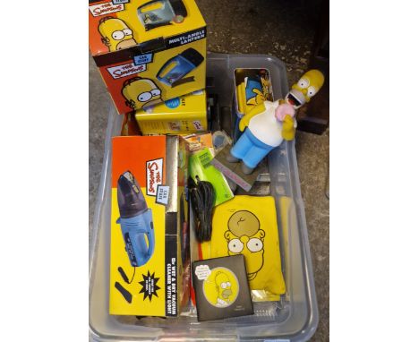 Plastic box of The Simpsons Car Care items to include: car care kit, Hula Homer, wet and dry vacuum cleaner with light, multi