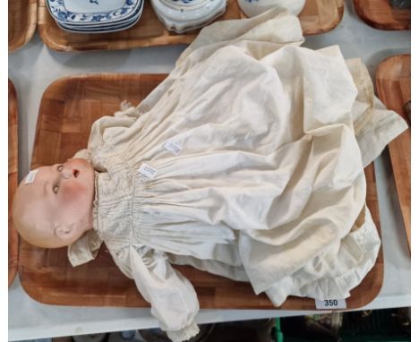 Early 20th century German Armand and Marseille bisque headed doll, having rolling eyes and painted features, in possibly orig
