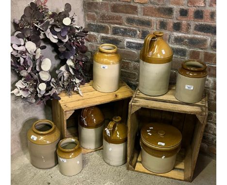 Collection of stoneware flagons and utensil jars, all appearing un-named. (8)  (B.P. 21% + VAT)