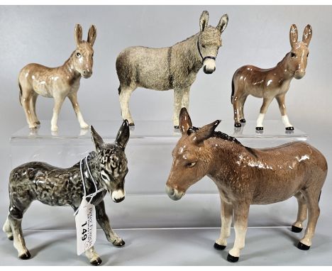 Three Beswick Donkeys, together with a Goebel Donkey and a composition study of a Donkey. (5) (B.P. 21% + VAT).&nbsp;All donk